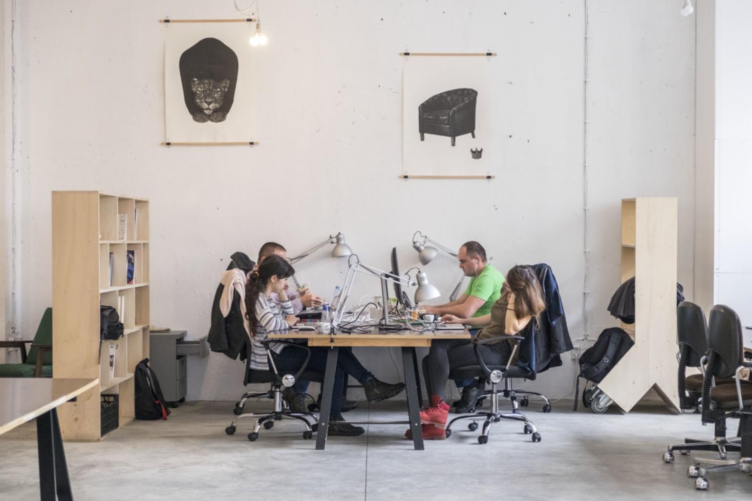 Professional color grading workstation with multiple monitors displaying video footage