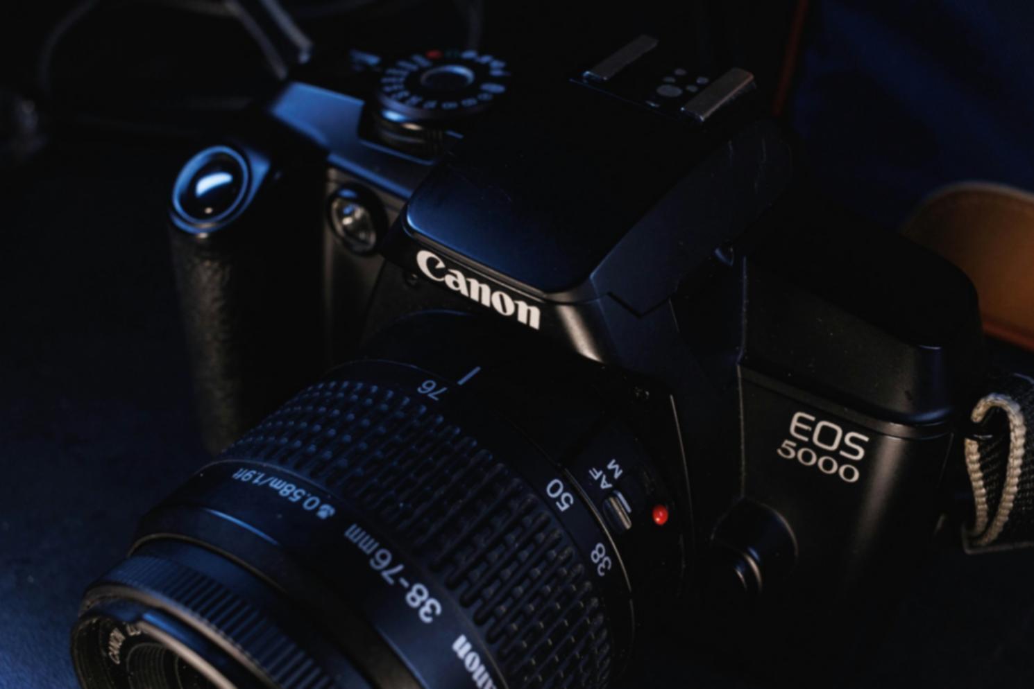 Colorist working on high-resolution display with grading panel controls